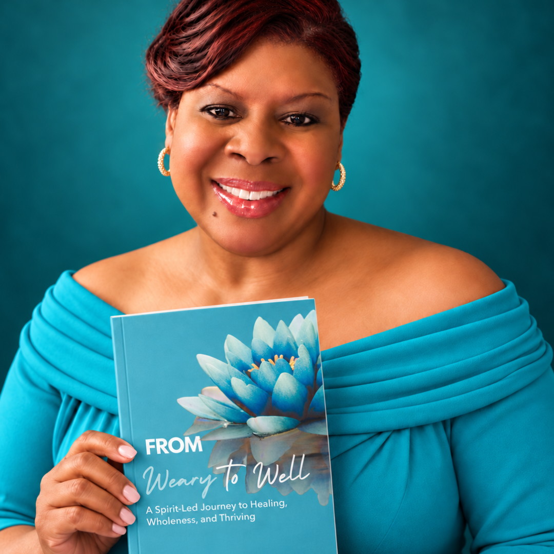 LaVonne Grace holding her book, From Weary to Well.