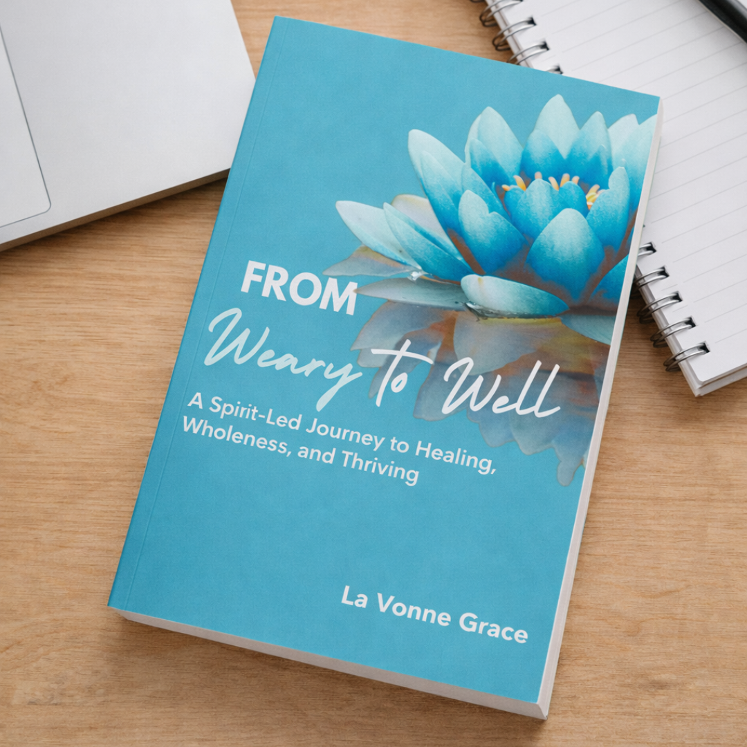From Weary to Well book resting on a wooden desk beside a laptop and notebook