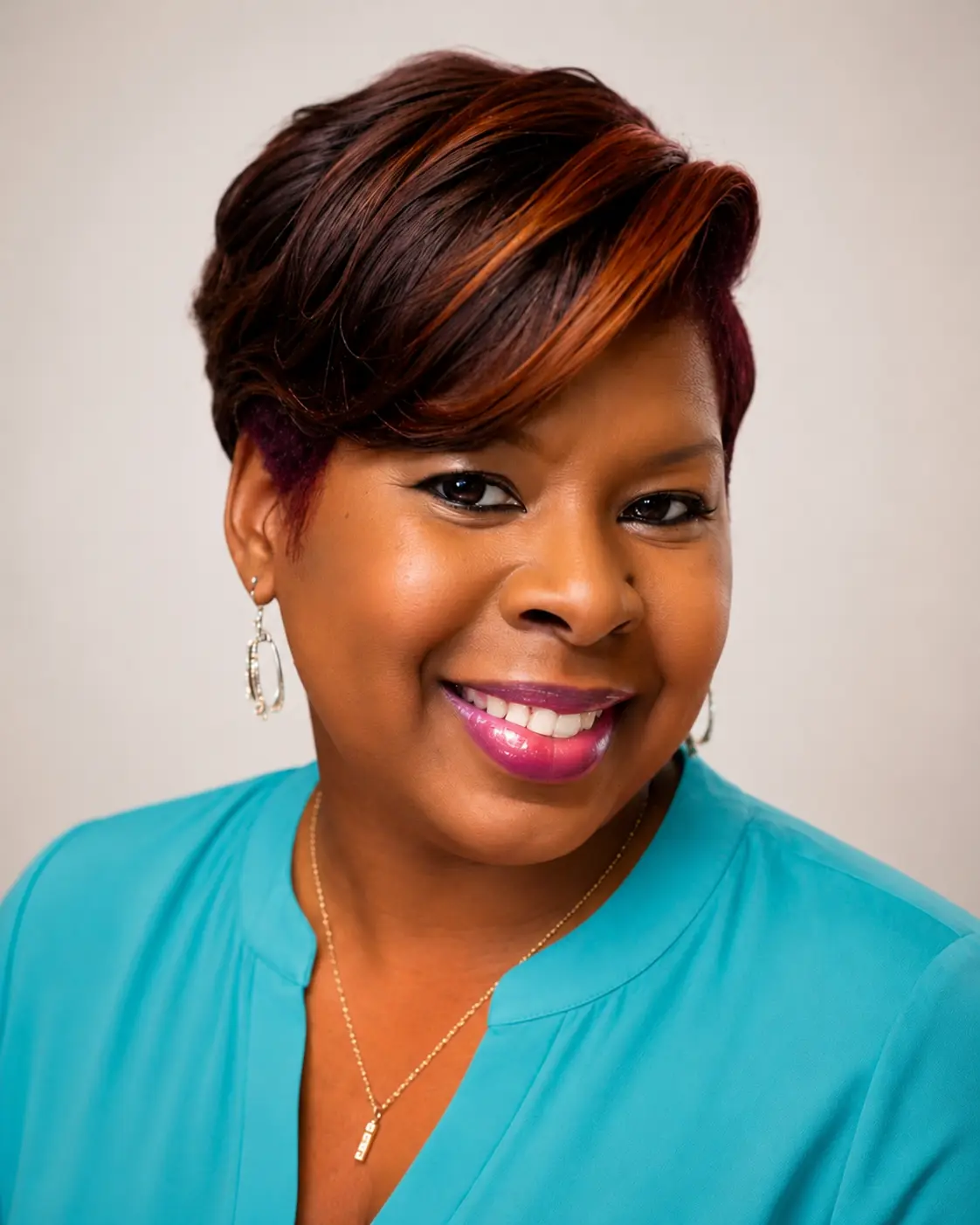 Portrait of LaVonne Grace in a teal blouse